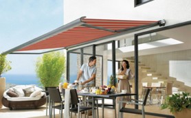 markilux 990 patio awning in red over patio dining area