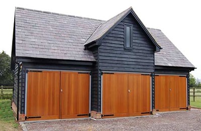 Side hinged timber doors on triple garage - Cedar