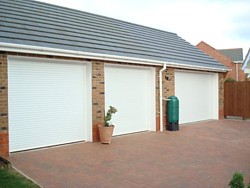 2 Seceuroglide Compact roller doors and a standard Seceuroglide