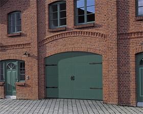 Timber sectional garage door with routed design and green factory finish