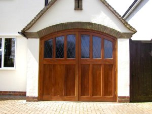 Purpose made side hinged timber garage doors with glazing in Bedfordshire