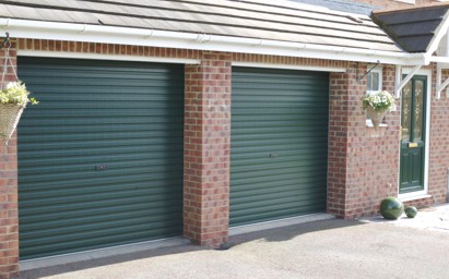 Gliderol roller shutter garagedoor installed on brick surface in green