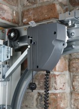 Novoport electric motor mounted to door track