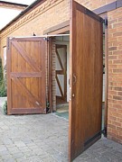 electrically operated side hinged garage doors