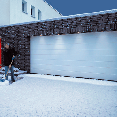 Insulating sectional garage door - snow