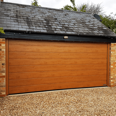 Woodgrain sectional garage door