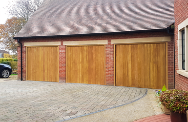 Woodrite Idigbo Up and Over Garage Door in Thames Design finished in Natural Oak