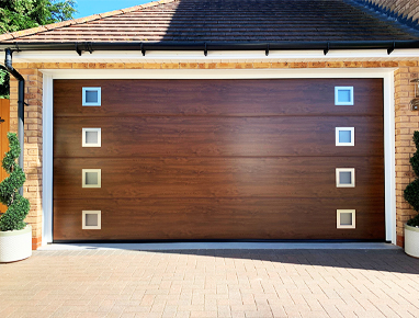 Sectional garage door in Dark Oak with windows