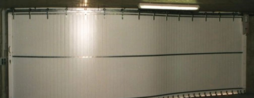Very large Rundum Meir biparting garage door in commercial application