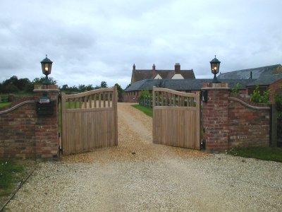 Pair of iroko timber automatic electric gates in Northamptonshire