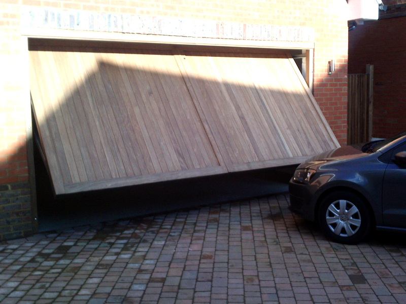 Woodrite Kenilworth Idigbo timber door installed inbetween double detached brick garage