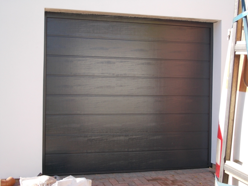 Hormann EPU40 M Ribbed steel Sectional in Anthracite Grey. Woodgrain finish