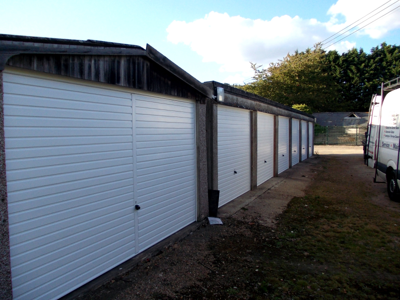 White Hormann 2002 steel up and over garage doors. Double and single size.