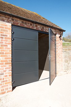 Steel side hinged insulated garage doors
