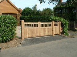 Automatic Iroko swing gates at Priors Hardwick, Northamptonshire