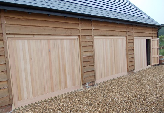 triple timber garage with pedestrian door