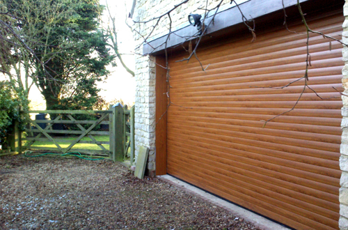 SeceuroGlide roller shutter in Golden Oak woodgrain finish 