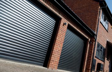 Two LT roller garage doors in black for double garage