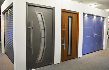 Roller doors, front entrance and side hinged doors featured in The Garage Door Centre showroom