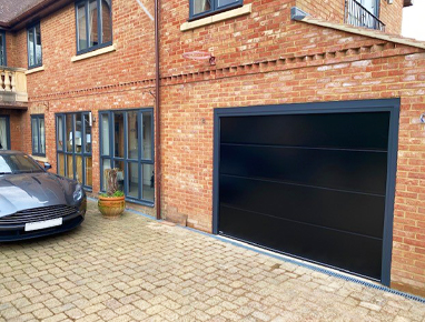 Carteck sectional garage door in Black Anthracite frame