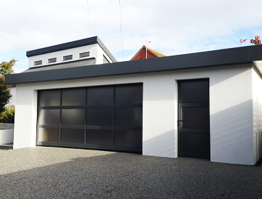 Glass garage door with black framing and matching side door