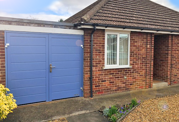 Hormann insulated side hinged garage door installation by The Garage Door Centre