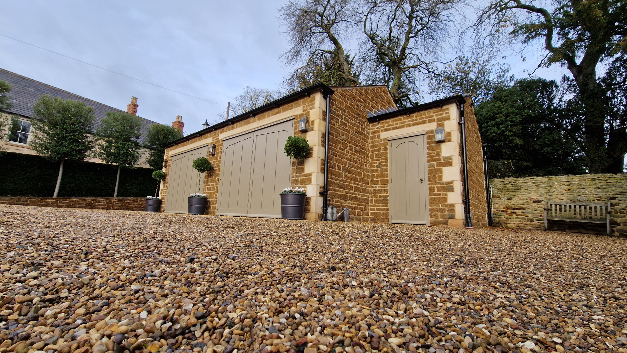 Timber garage doors with matching pedestrian door