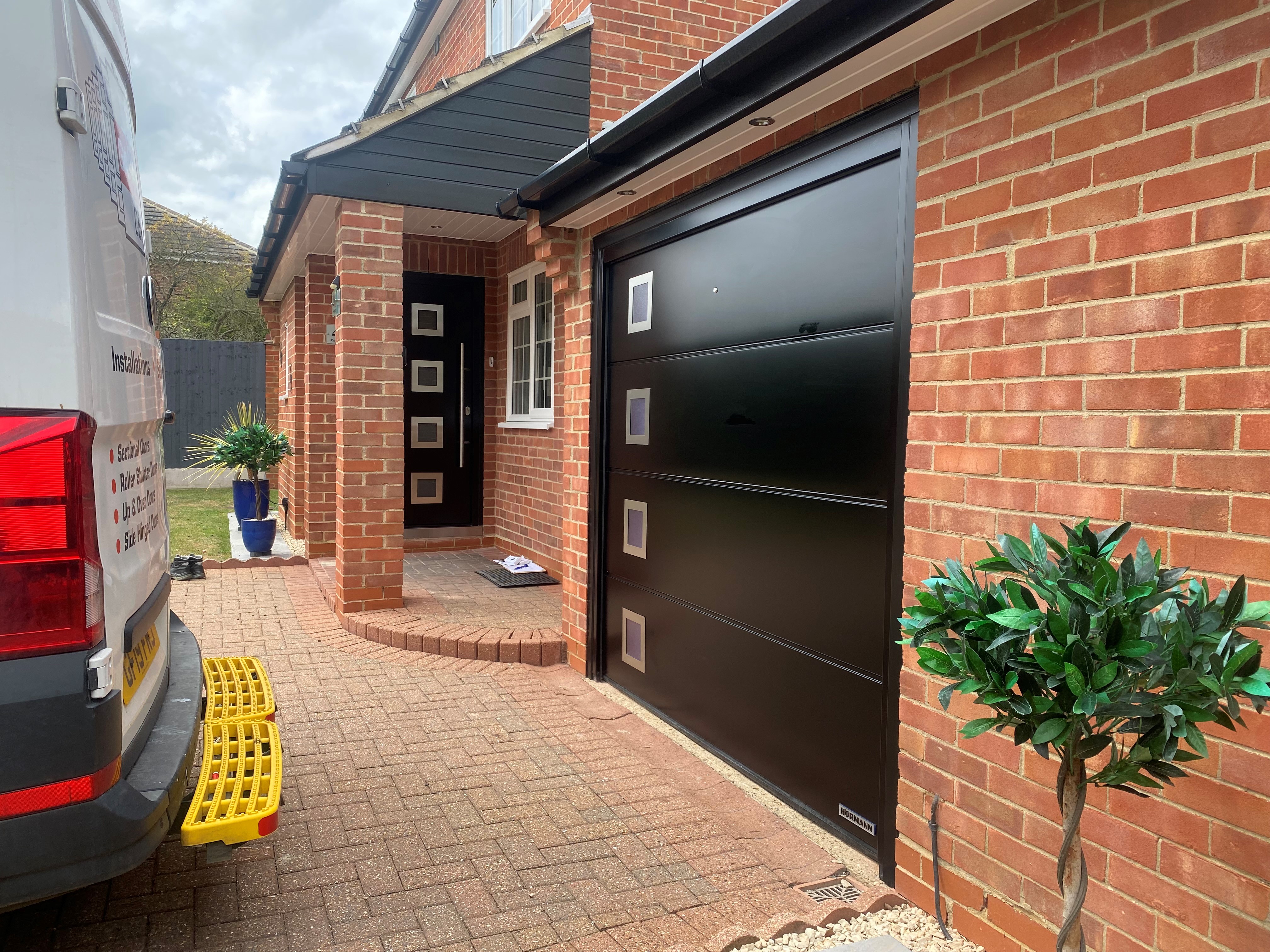 matching garage door and entrance door in black