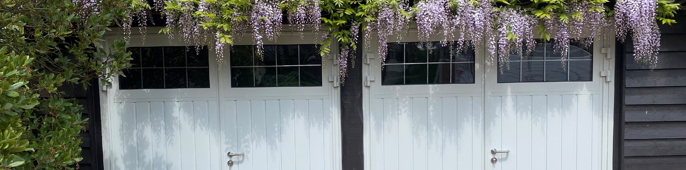 Twin side hinged doors in white