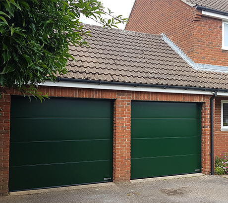 Green sectional garage doors