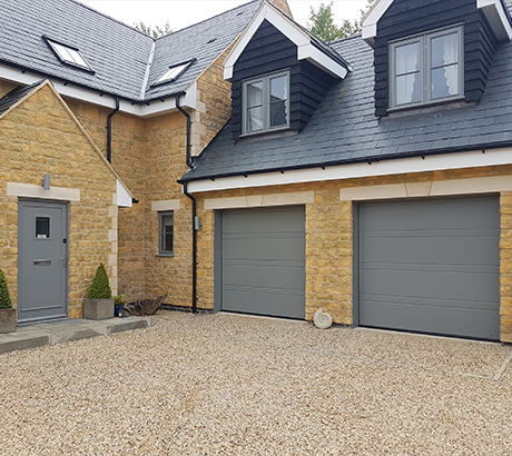 Pebble Grey Sectional Garage Door and Matching Front Door