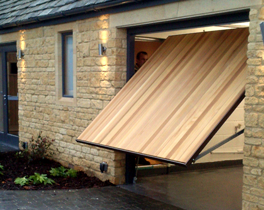 Vertical timber up and over door with frame