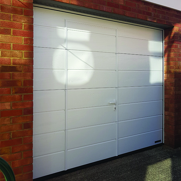 Wicket door within a sectional door