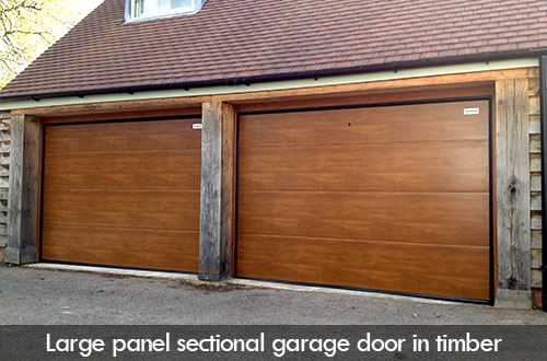 large panel sectional garage door in timber stronghaus