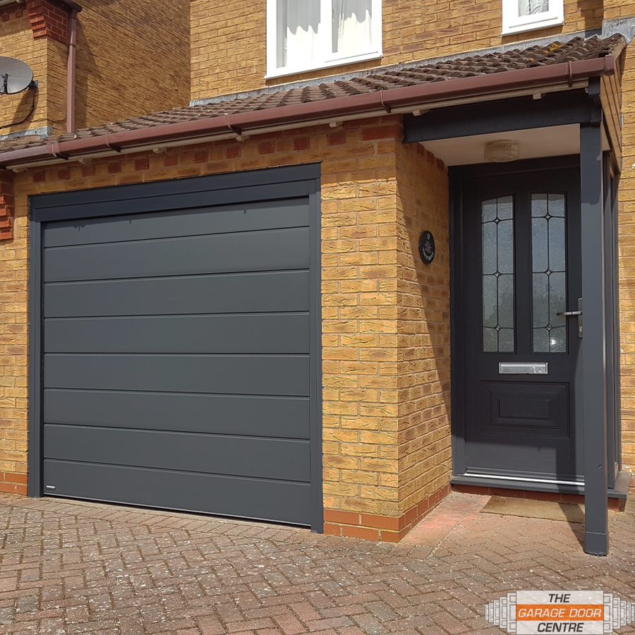 Grey Sectional Garage door Carteck matching with entrance door