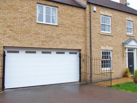 Double Hormann LPU40 M ribbed steel sectional in white with windows